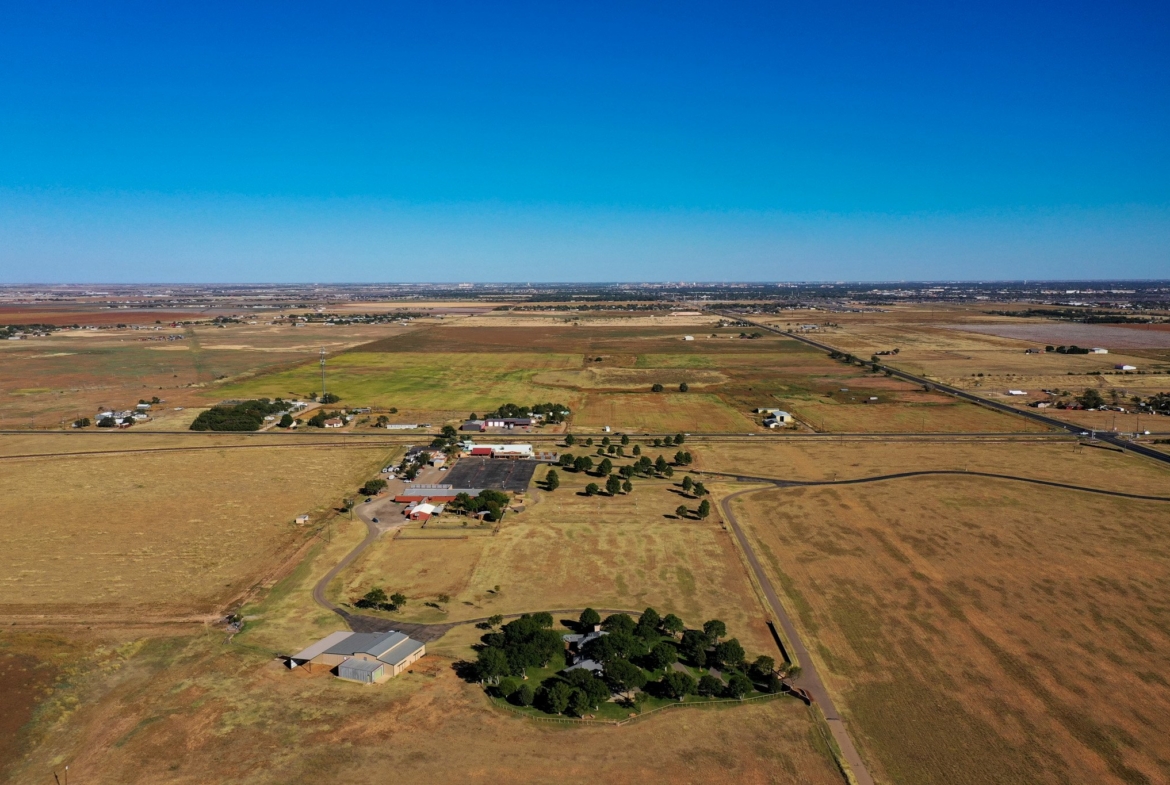 Aerial view of the corner tract and neighboring properties in West Lubbock, TX